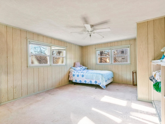 carpeted bedroom with a ceiling fan