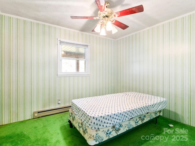 carpeted bedroom with a baseboard radiator, ceiling fan, and crown molding