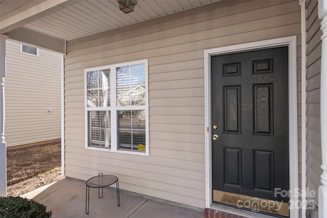 doorway to property with visible vents