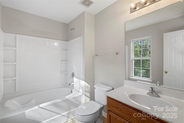 bathroom featuring visible vents, toilet, vanity, and shower / bathing tub combination