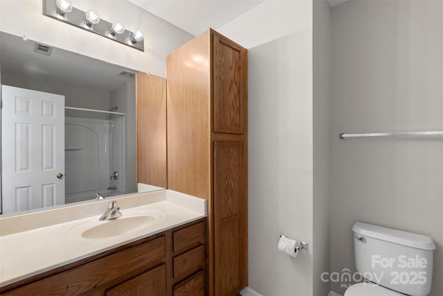 full bath with visible vents, toilet, walk in shower, and vanity