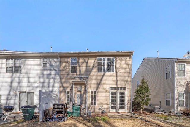 rear view of property featuring central AC unit