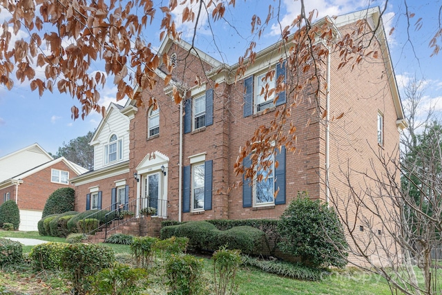 view of front of house with brick siding