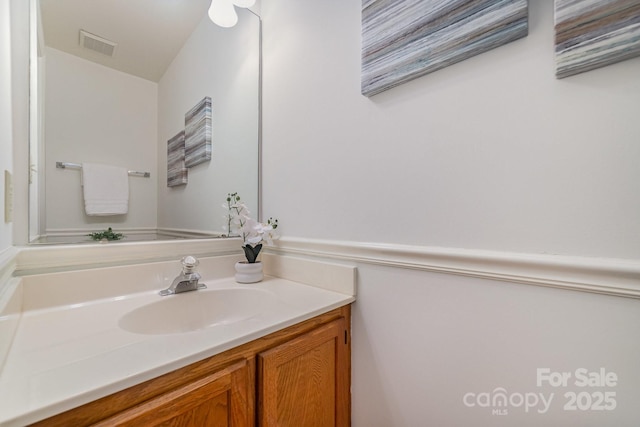 bathroom with visible vents and vanity