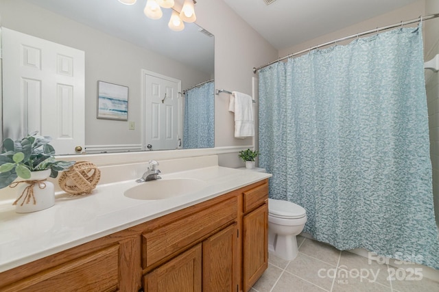 full bath featuring a chandelier, toilet, visible vents, vanity, and tile patterned floors