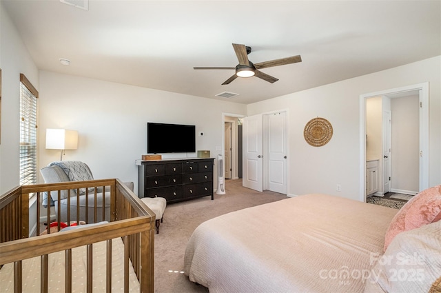 bedroom featuring carpet floors, visible vents, and ceiling fan