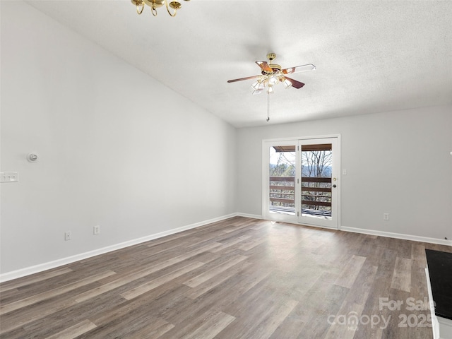 unfurnished room with baseboards, a ceiling fan, and wood finished floors