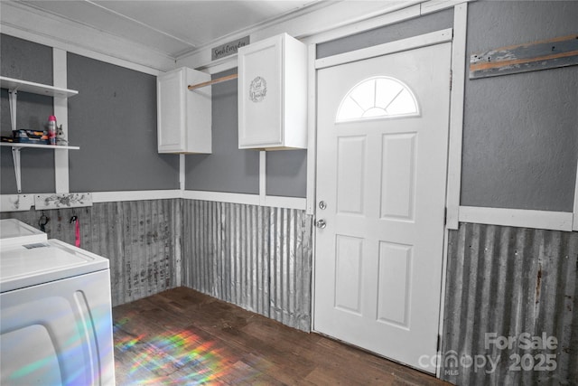 washroom featuring washer and dryer and wood finished floors