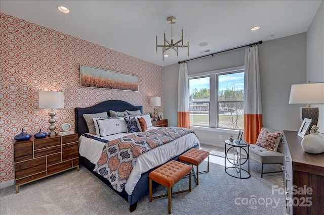 carpeted bedroom featuring baseboards, recessed lighting, an accent wall, and wallpapered walls