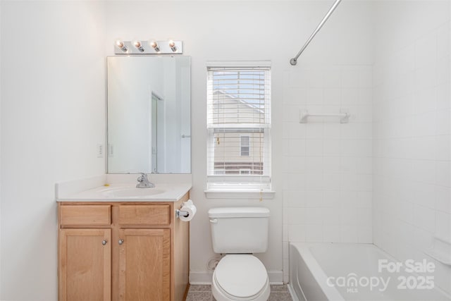 bathroom featuring shower / tub combination, toilet, vanity, and baseboards