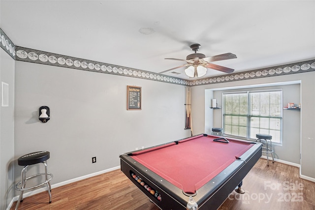 recreation room with a ceiling fan, billiards, baseboards, and wood finished floors