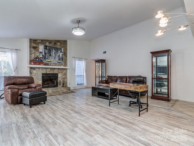 interior space featuring a stone fireplace and wood finished floors