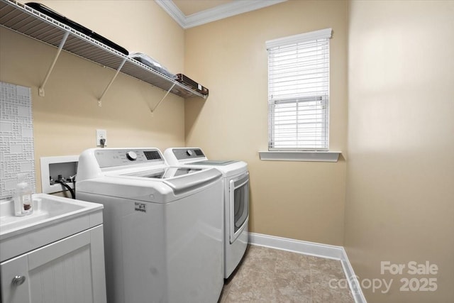 laundry room with light tile patterned floors, cabinet space, ornamental molding, independent washer and dryer, and baseboards