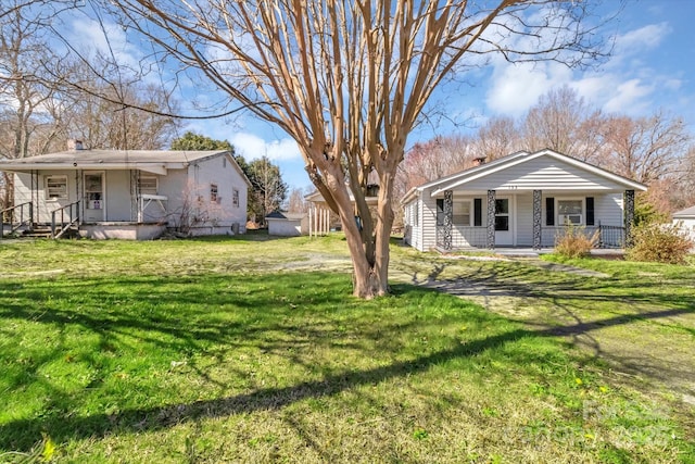 view of yard with covered porch