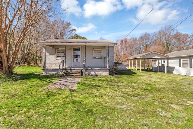 view of front of property with covered porch and a front yard