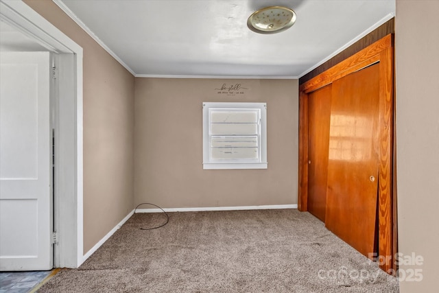 interior space featuring baseboards and crown molding