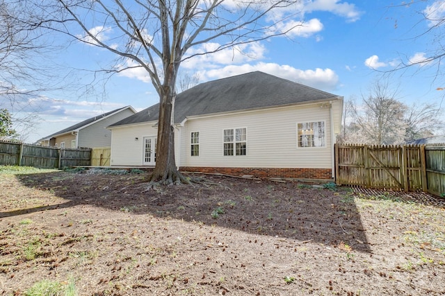 back of property featuring fence