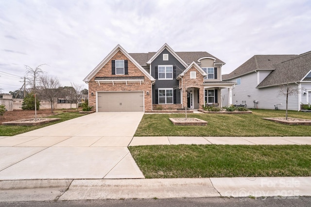 craftsman inspired home with a garage, driveway, and a front yard