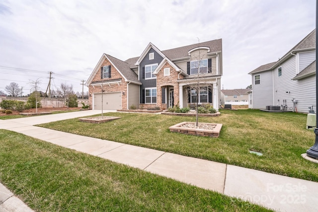 view of front of house with stone siding, concrete driveway, and a front yard