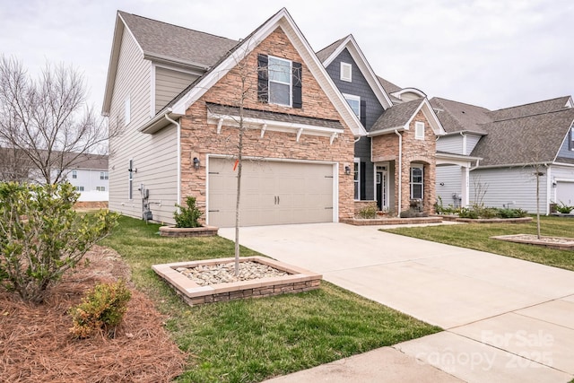 view of front facade with a front lawn, an attached garage, stone siding, and driveway