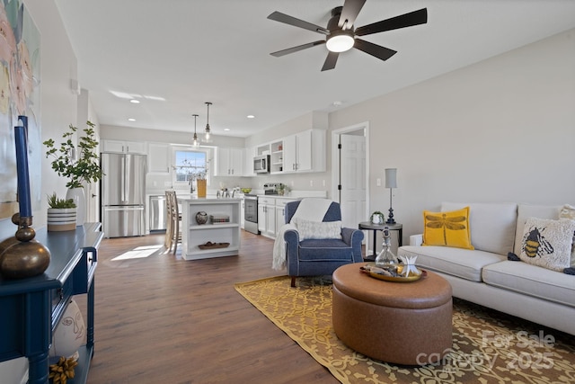 living room with dark wood-style floors, recessed lighting, and a ceiling fan