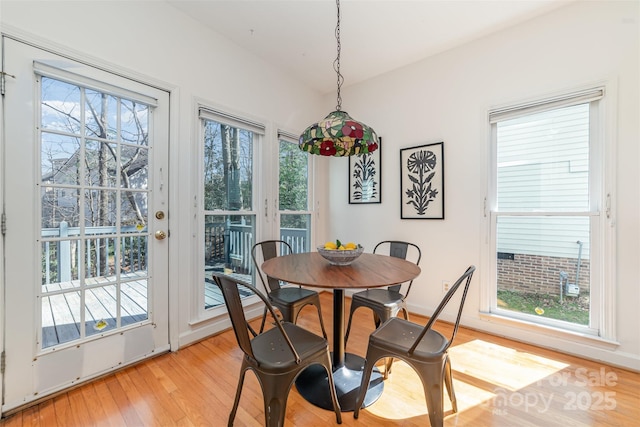 dining area featuring light wood finished floors