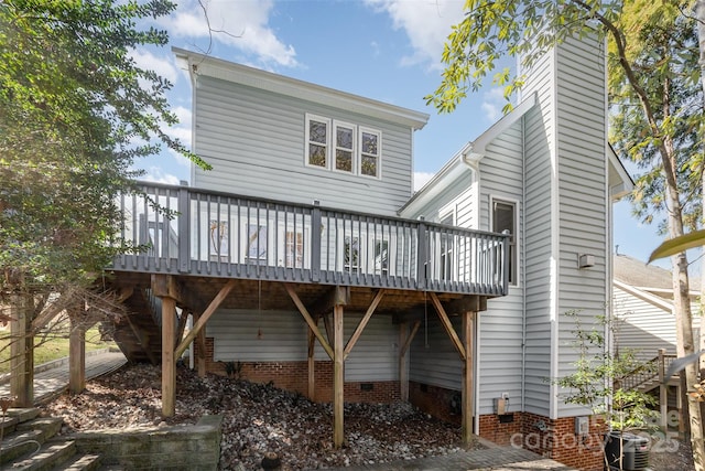 back of house featuring a deck, crawl space, and central air condition unit