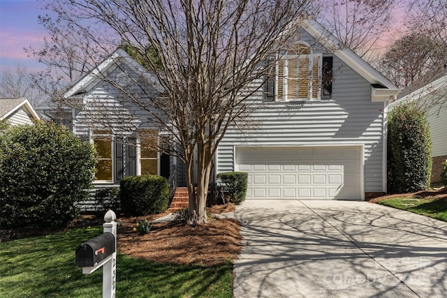 view of front of house with a garage and driveway