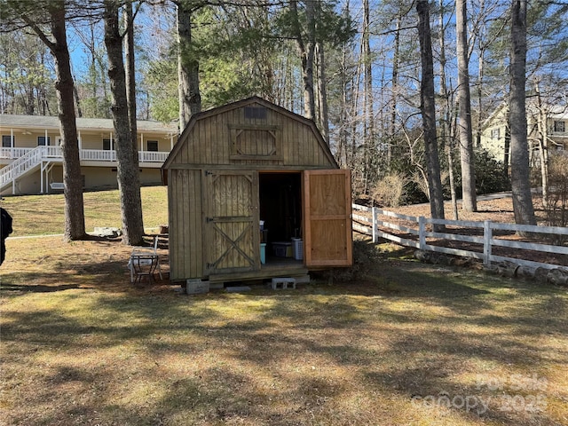 view of shed with fence