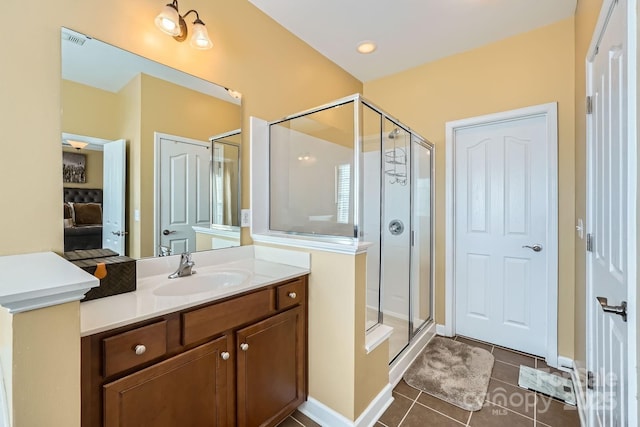 bathroom with visible vents, baseboards, tile patterned floors, vanity, and a shower stall