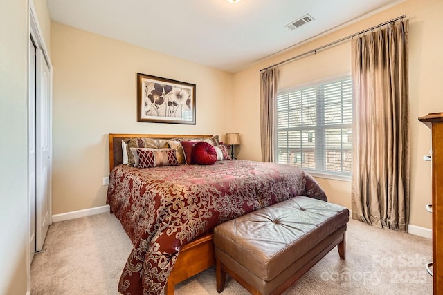 bedroom featuring carpet, visible vents, and baseboards