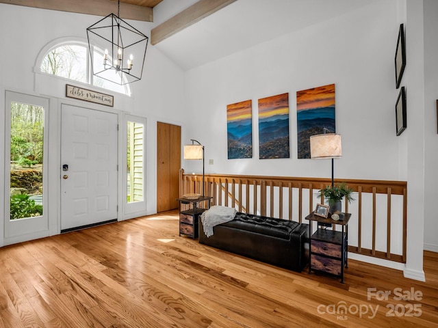 209 Walnut Ridge Rd, Brevard, NC 28712 - entryway with a chandelier, wood finished floors, high vaulted ceiling, and a healthy amount of sunlight