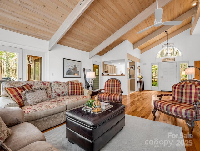 209 Walnut Ridge Rd, Brevard, NC 28712 - living area featuring a healthy amount of sunlight, wood finished floors, beam ceiling, and high vaulted ceiling