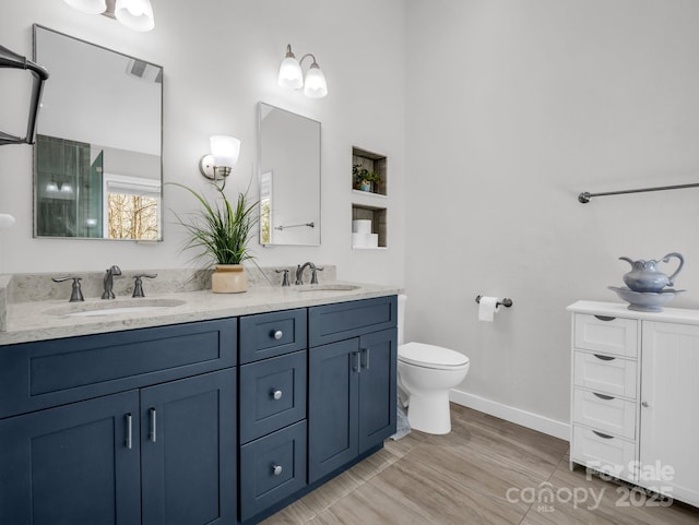 209 Walnut Ridge Rd, Brevard, NC 28712 - full bathroom featuring toilet, double vanity, a sink, and visible vents