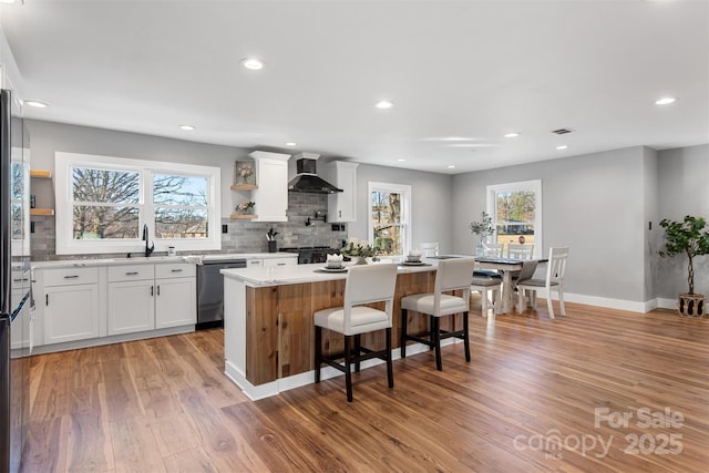 1206 9th St NW, Hickory, NC 28601 - kitchen featuring dishwasher, open shelves, wall chimney exhaust hood, a center island, and recessed lighting