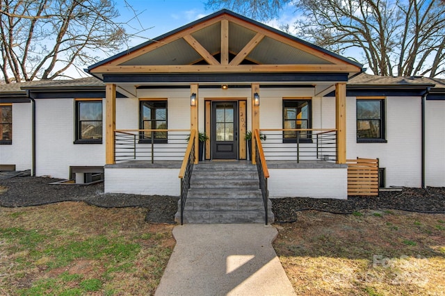 1206 9th St NW, Hickory, NC 28601 - view of front of property featuring brick siding, covered porch, and roof with shingles