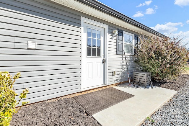 doorway to property with a patio area