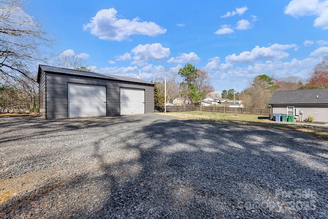 detached garage with fence