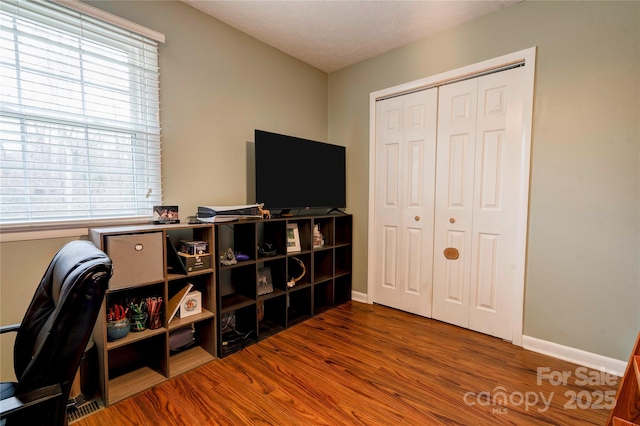 office with wood finished floors and baseboards