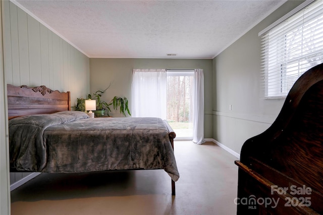 bedroom with crown molding, access to exterior, visible vents, and a textured ceiling