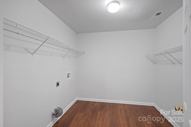 laundry room featuring laundry area, visible vents, washer hookup, and baseboards