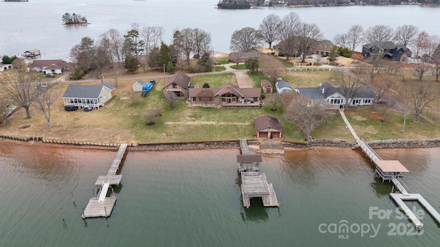 birds eye view of property with a residential view and a water view
