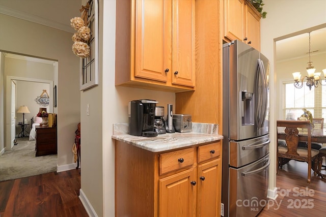 kitchen featuring crown molding, baseboards, stainless steel fridge with ice dispenser, a chandelier, and dark wood finished floors