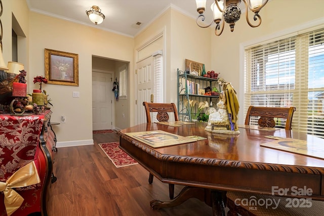 home office with a notable chandelier, wood finished floors, baseboards, and ornamental molding