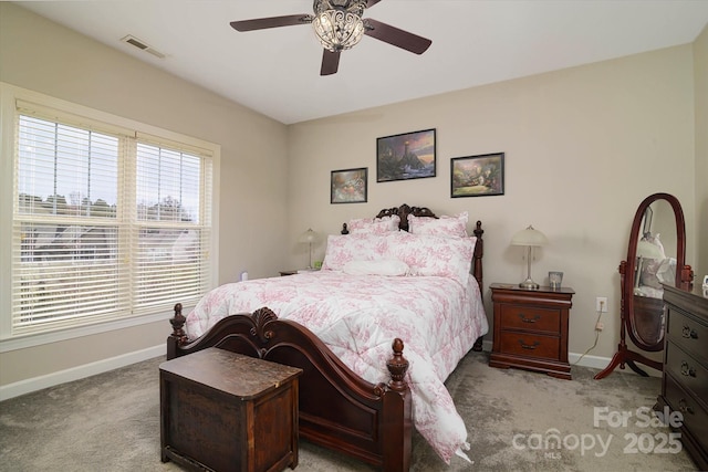 bedroom with visible vents, baseboards, ceiling fan, and carpet flooring