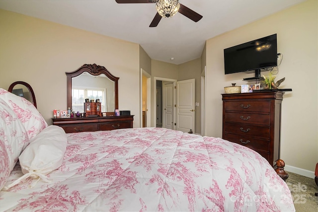 bedroom featuring carpet flooring, a ceiling fan, and baseboards