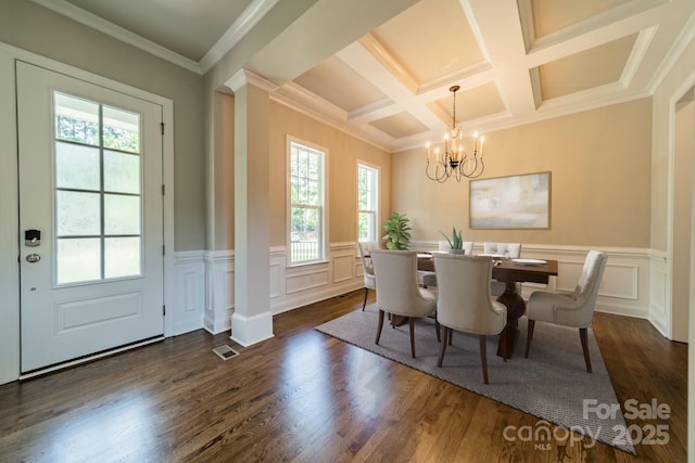 dining area featuring dark wood-style flooring, coffered ceiling, visible vents, and a notable chandelier