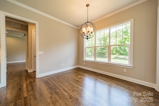 unfurnished room with dark wood-style flooring, visible vents, ornamental molding, a chandelier, and baseboards