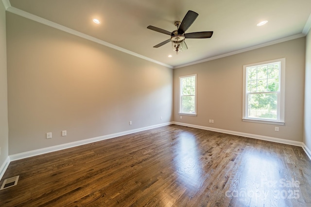 spare room featuring ornamental molding, visible vents, and baseboards