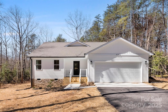 ranch-style house with aphalt driveway, crawl space, an attached garage, and a shingled roof